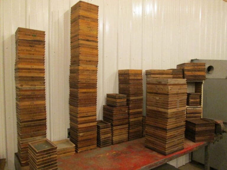 A room filled with lots of wooden boxes.