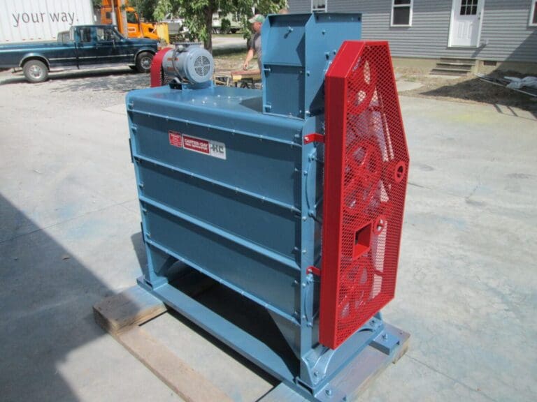 A blue and red machine is on the ground