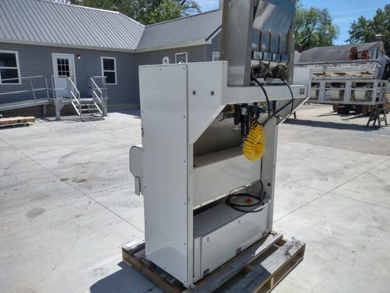 A large metal machine sitting on top of concrete.