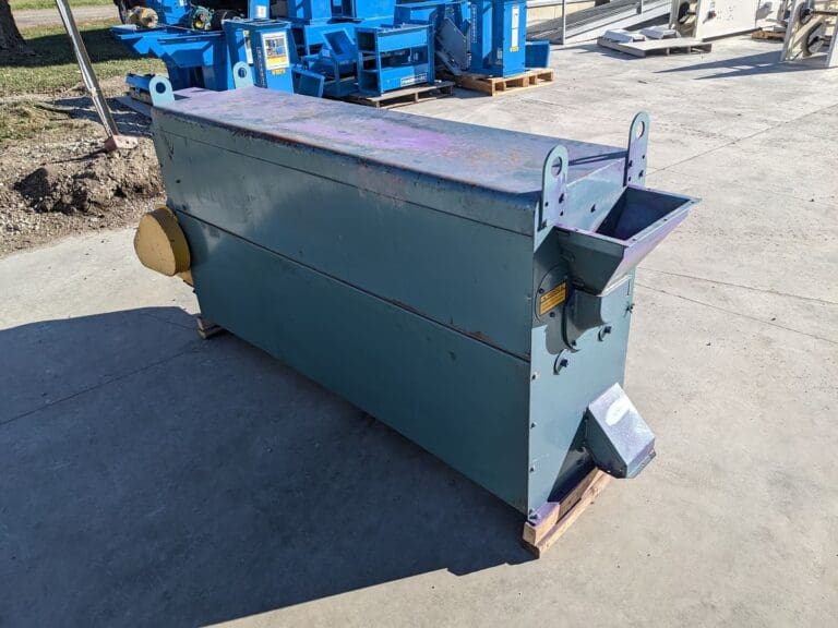 A large metal box sitting on top of concrete.