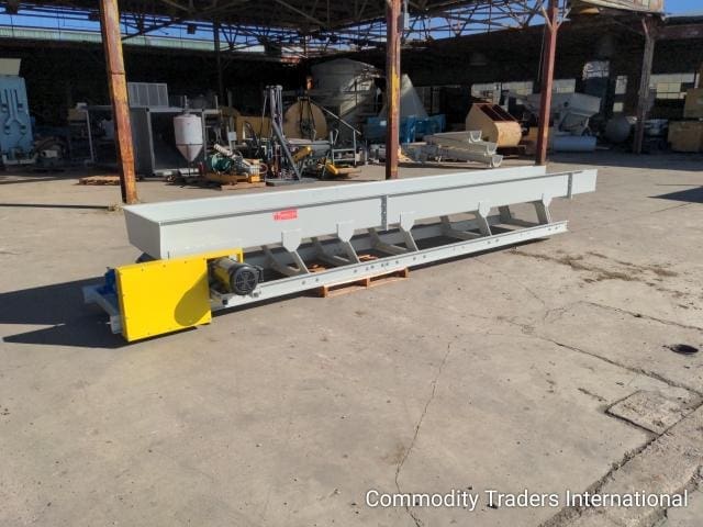 A large metal object sitting on top of concrete.