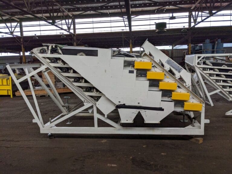 A white and yellow staircase in an industrial setting.