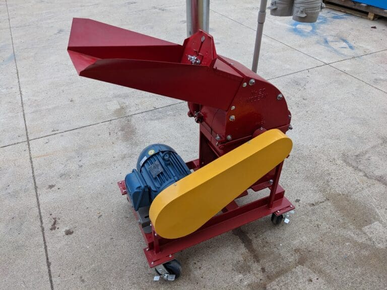 A red and yellow machine is on the ground