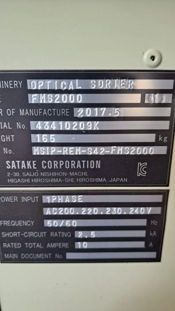 A close up of two metal signs with information on them.