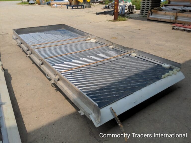 A large metal bed frame with a mattress on top.