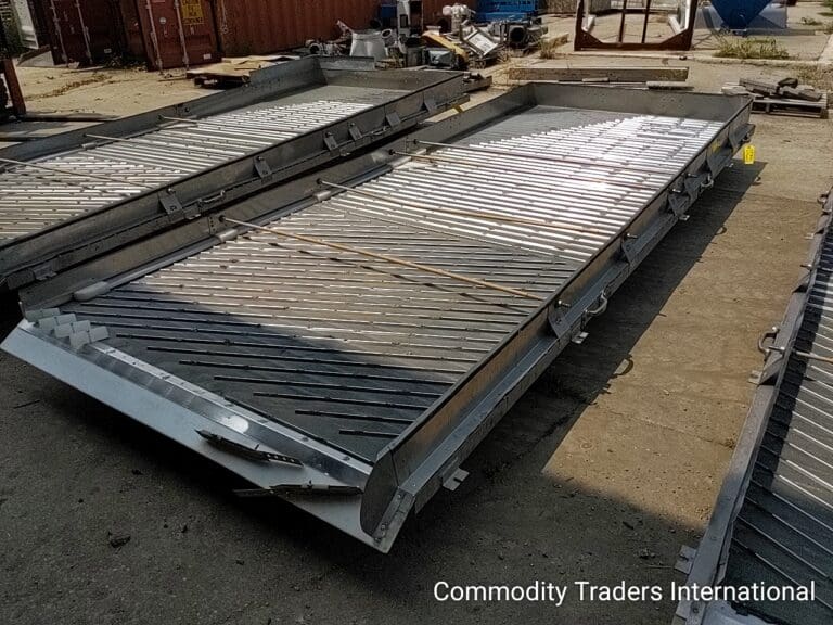A couple of metal ramps that are on the ground.