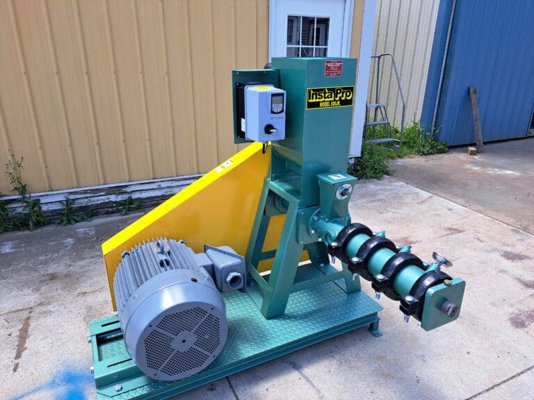 A green machine with a yellow and blue motor.