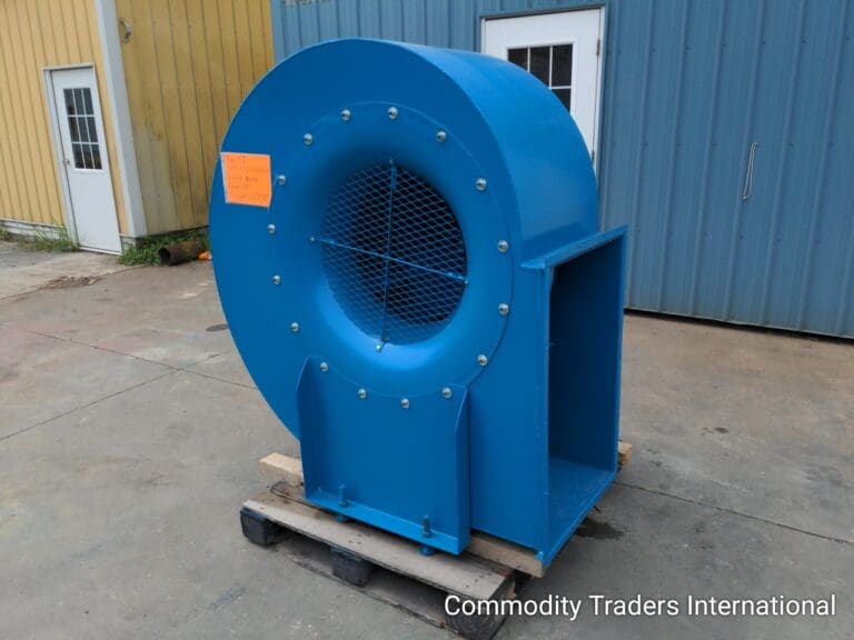 A blue industrial fan sitting on top of a wooden cart.