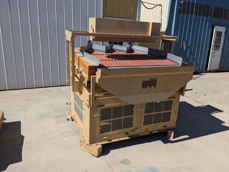 A large machine sitting on top of concrete.