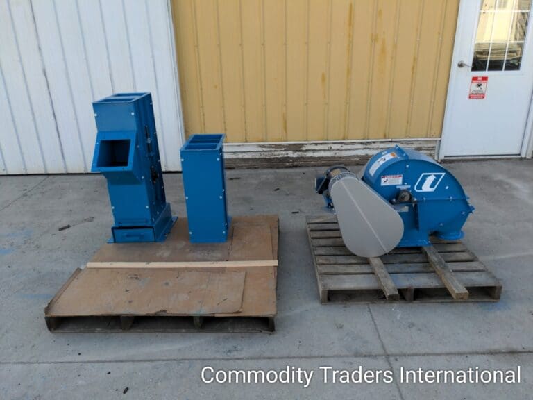 A couple of blue boxes sitting on top of a wooden pallet.