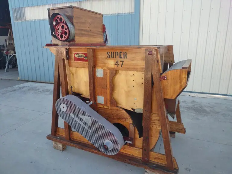 A wooden cart with a large machine on it.
