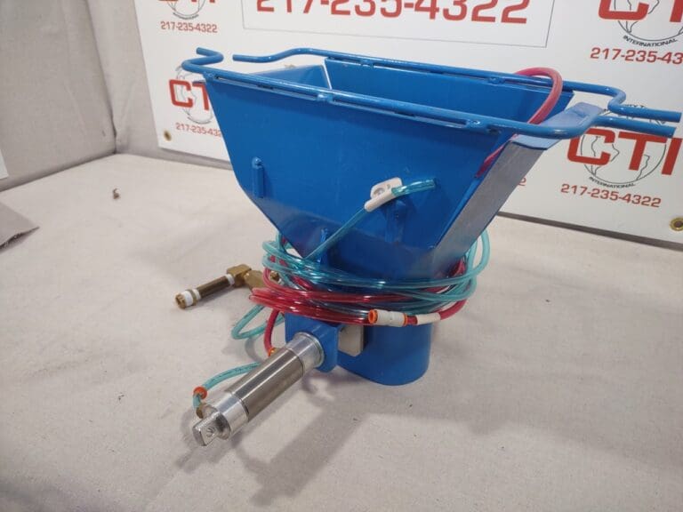 A blue bucket with wires attached to it.