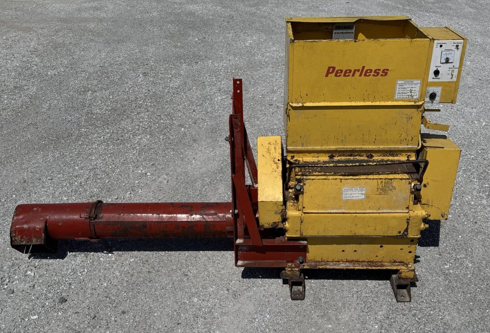 A yellow and red machine on the ground