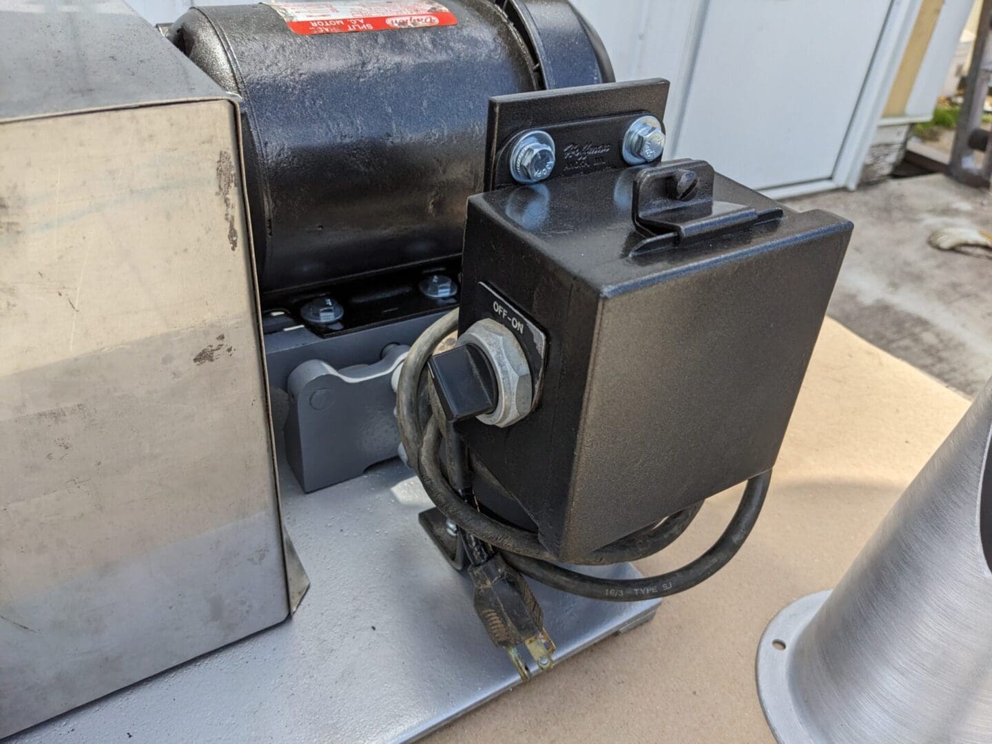 A black box sitting on top of a metal table.