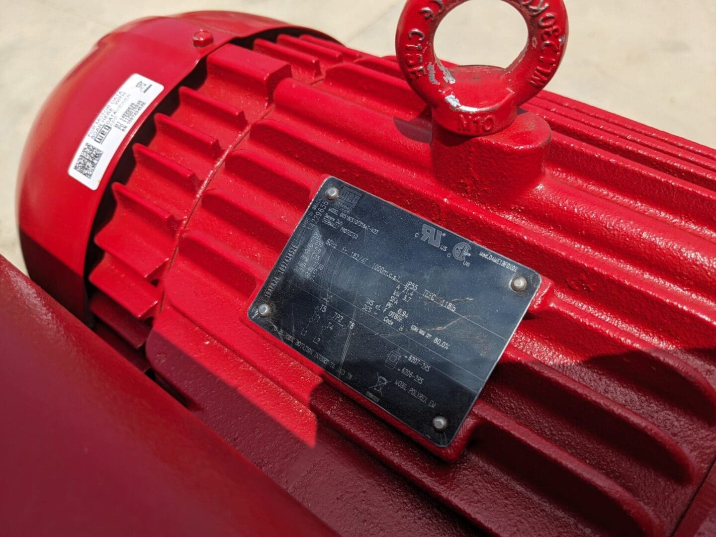 A red box with a plaque on it