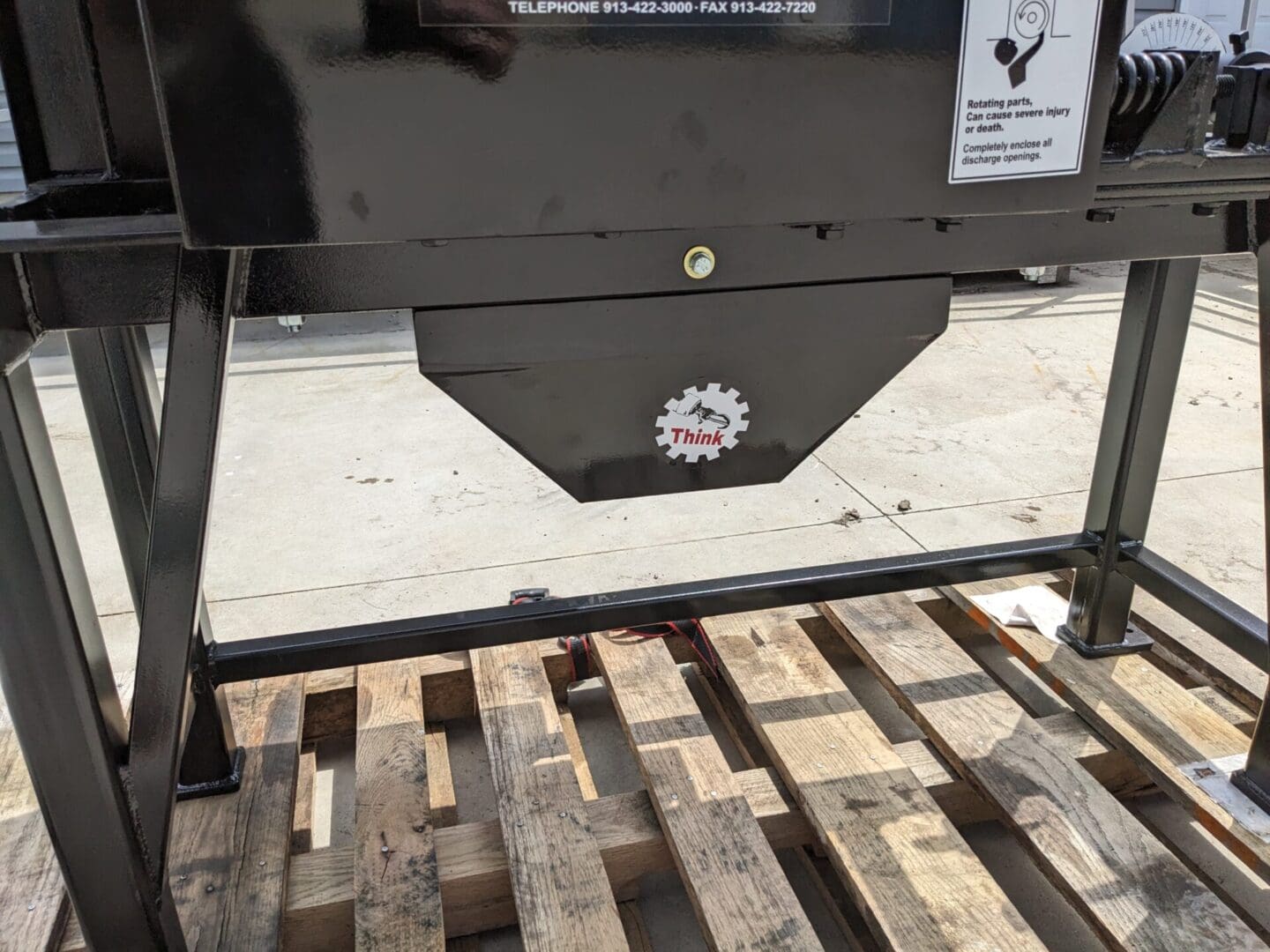 A black box with a wooden pallet on top of it.