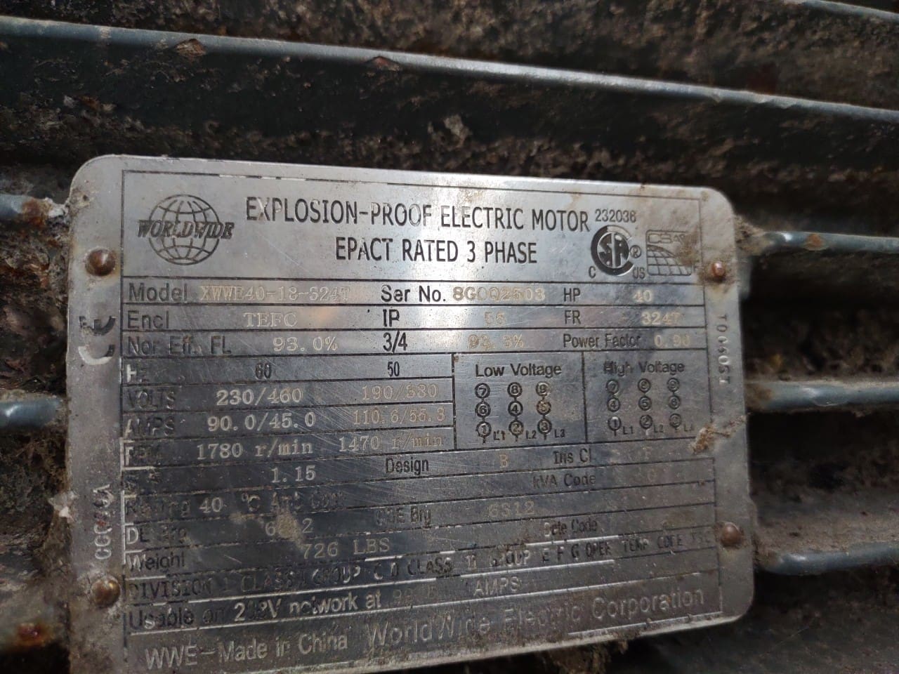 A metal plate with the words " l. Coughlin-wolf electric motor " printed on it