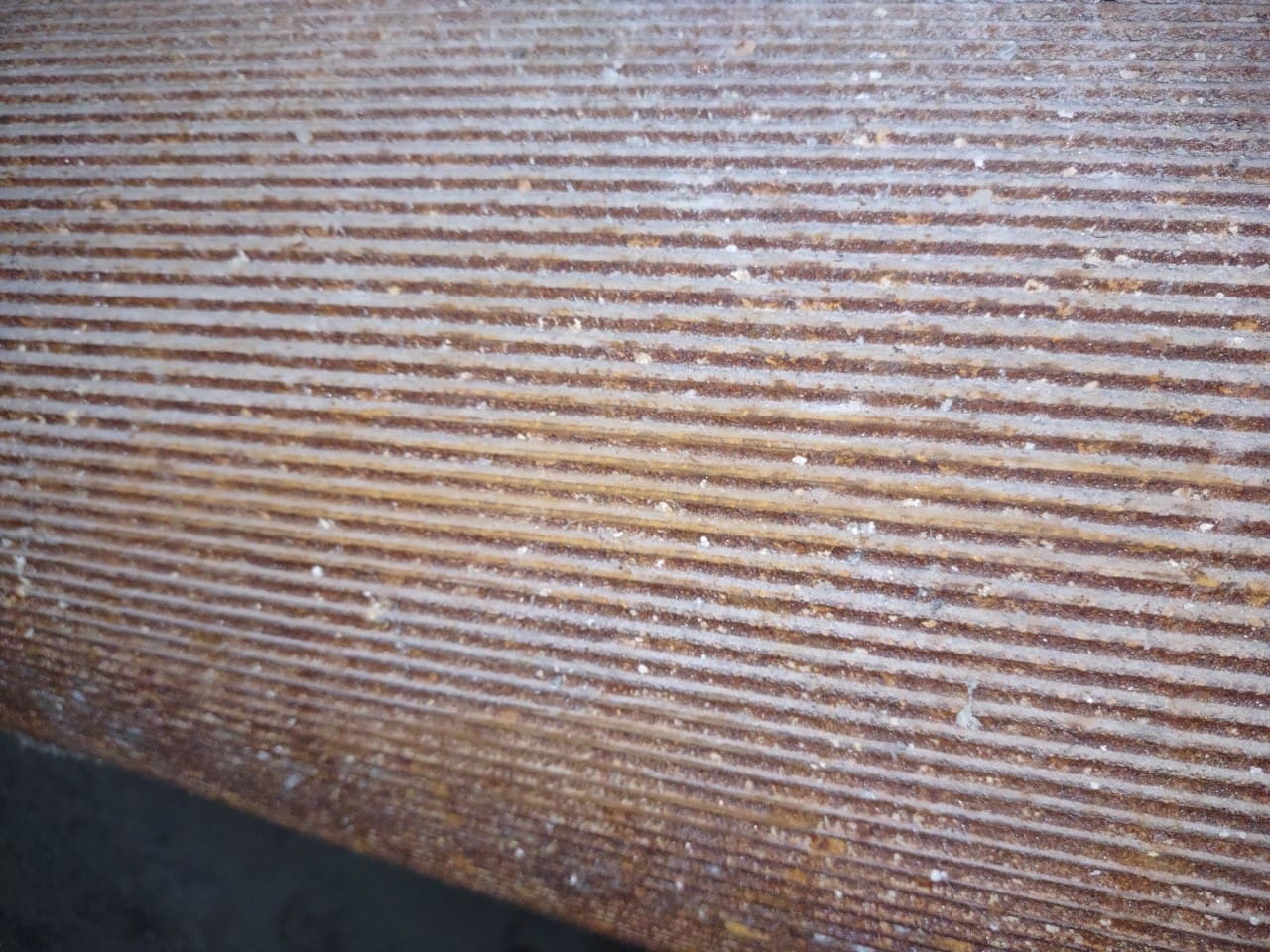 A close up of the bottom of a wooden table