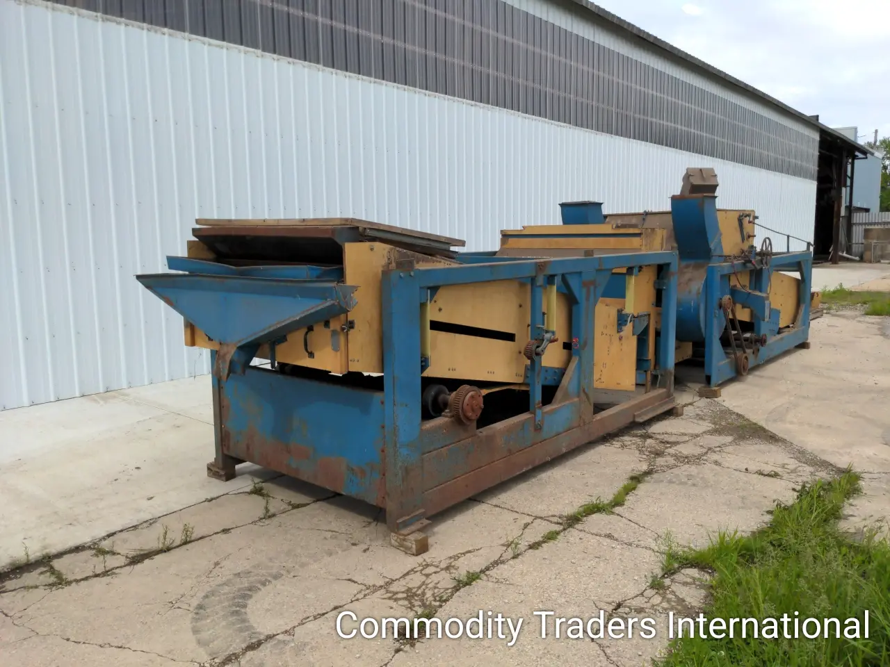 A blue and yellow machine is on the street