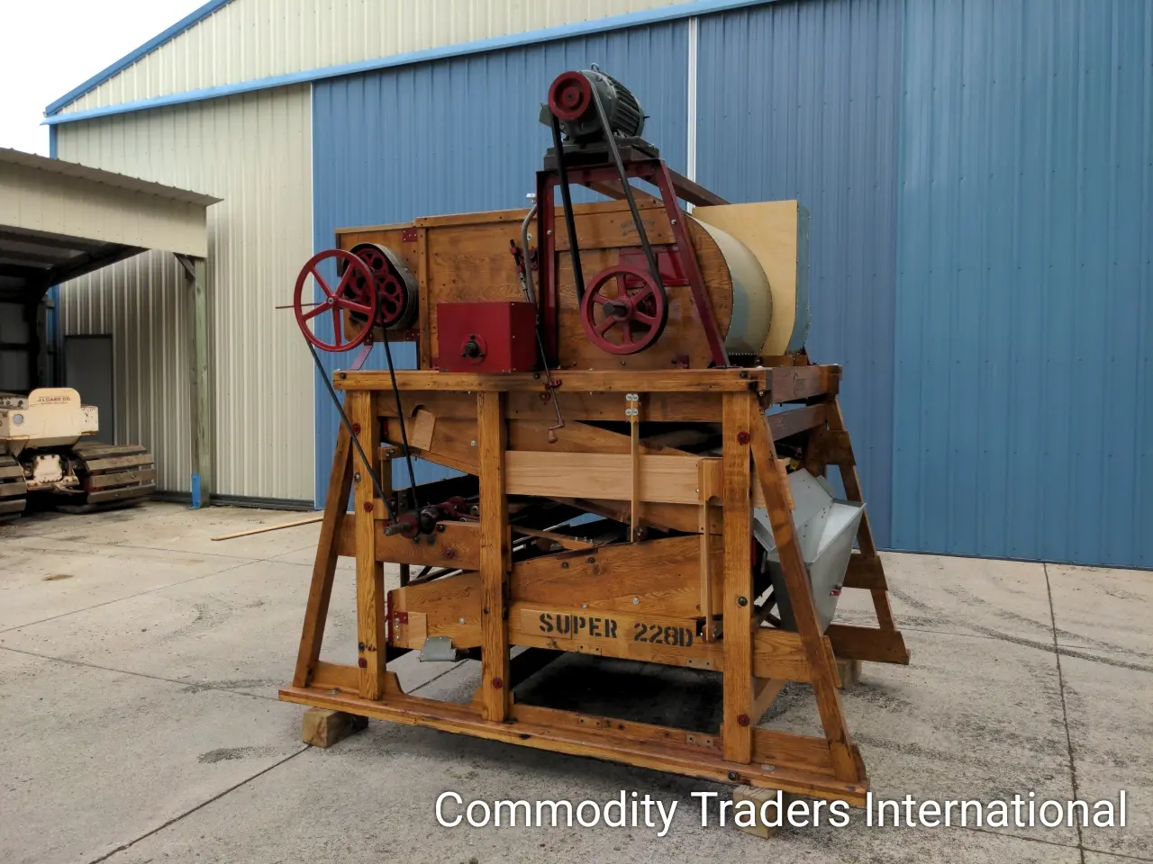 A wooden crate with two large machinery on it.