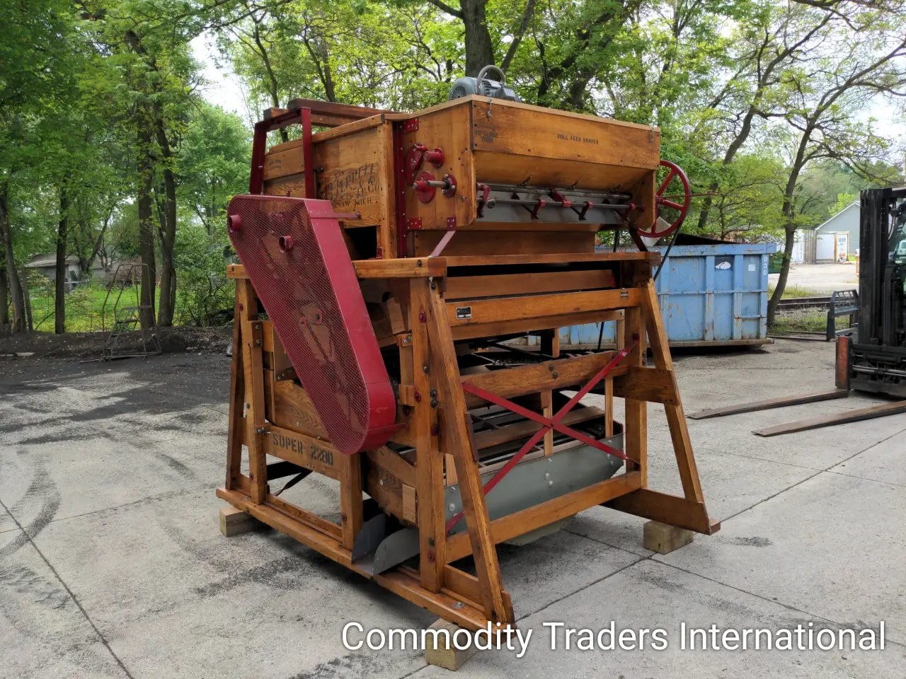 A wooden cart with some sort of machine in it