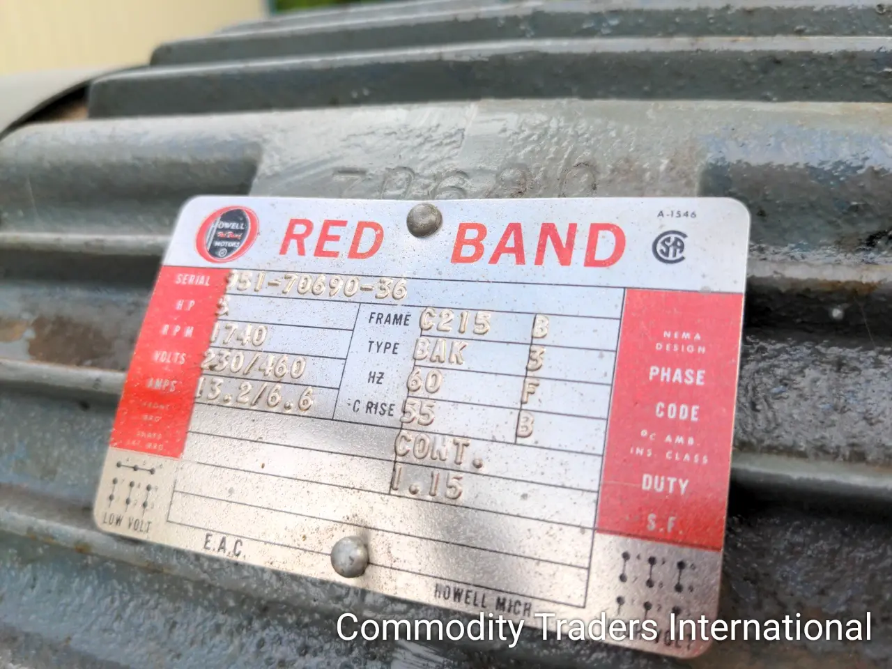 A metal sheet with red band written on it.