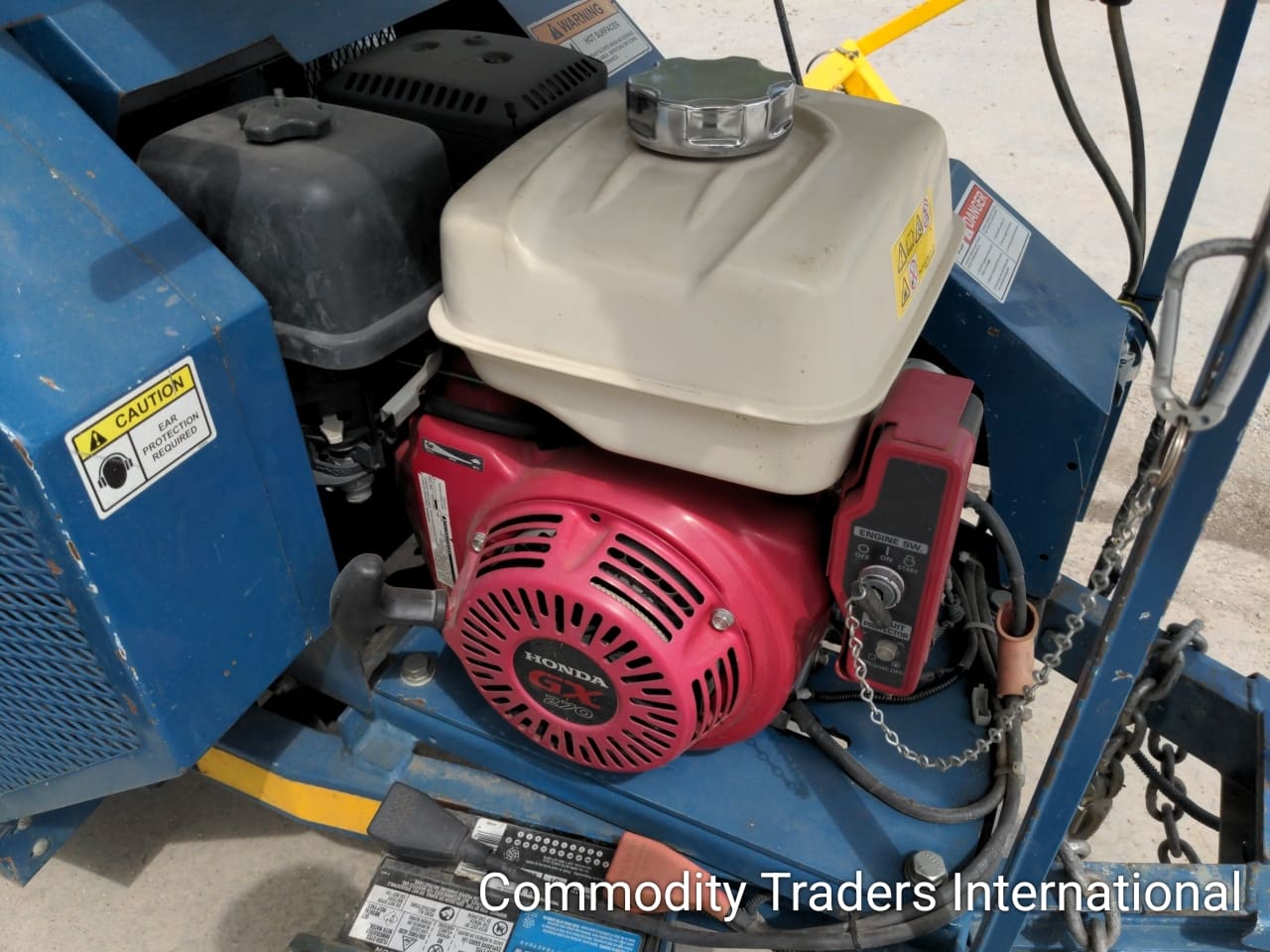 A red and black engine sitting in the middle of a blue box.