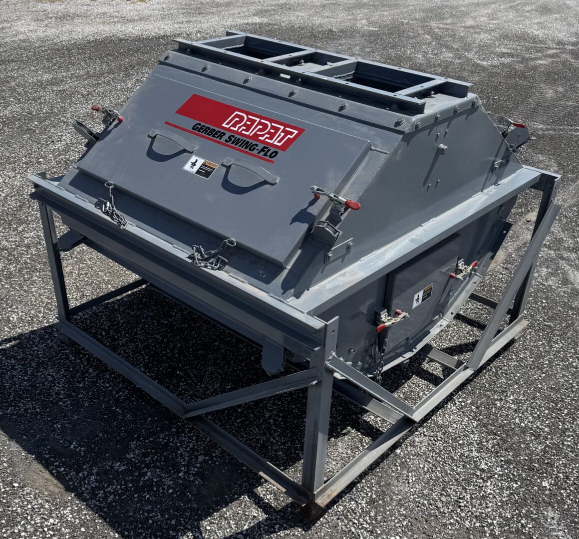 A large metal object sitting on top of a concrete ground.