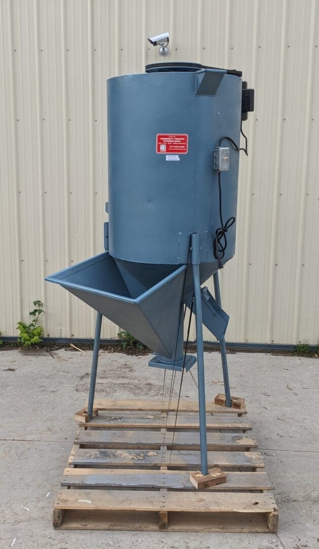 A blue bin sitting on top of a wooden platform.