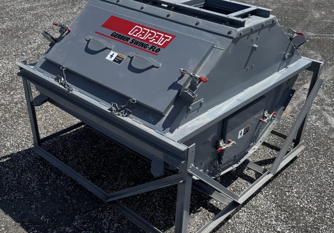 A large metal object sitting on top of a concrete ground.