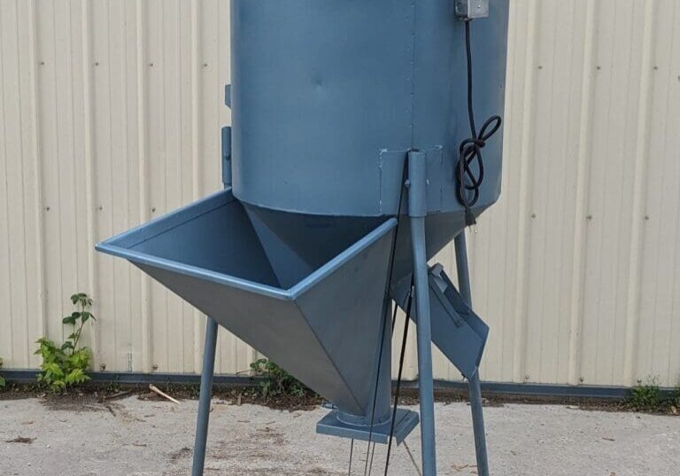 A blue bin sitting on top of a wooden floor.